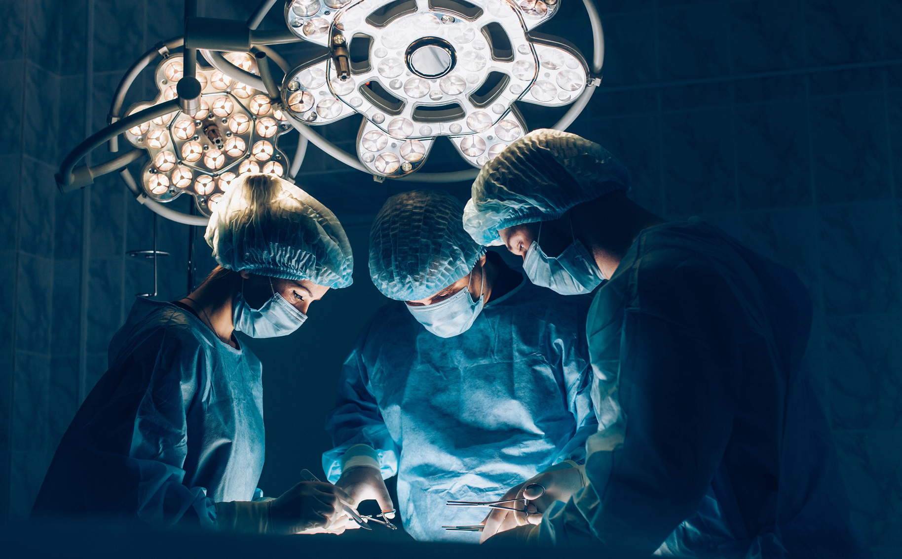 Group of doctors performing hernia surgery