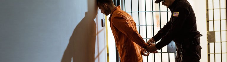 Prisoner handcuffed by a cop